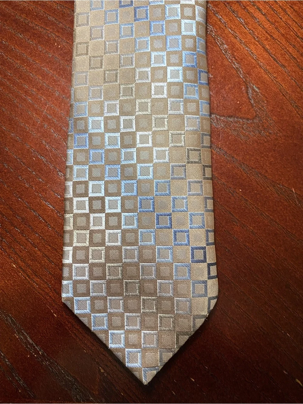 Men’s neck tie by Murano in light brown with a hint of blue & gray small squares